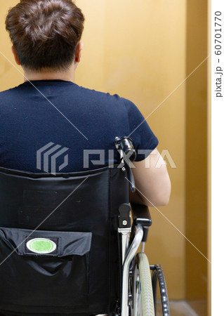 Disabled handicapped man sitting on wheelchair 063 Disabled handicapped man sitting on wheelchair 063 60701770