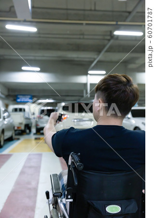 Disabled handicapped man sitting on wheelchair 028 60701787