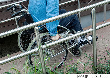 Disabled handicapped man sitting on wheelchair 011 60701822