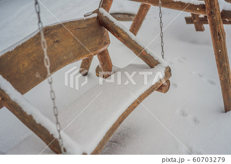 Benches in the winter city park which has been filled up with snow Benches in the winter city park which has been filled up with snow 60703279