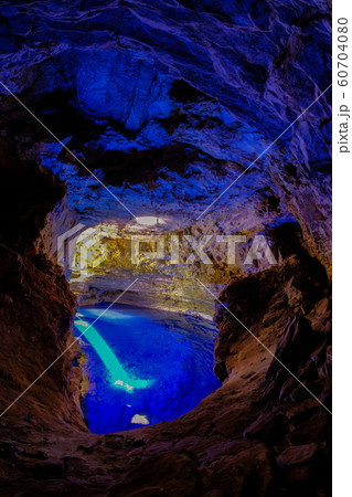 Poco Encantado, blue lagoon with sunrays inside a cavern in the Chapada Diamantina, Andarai, Bahia, Brazil 60704080