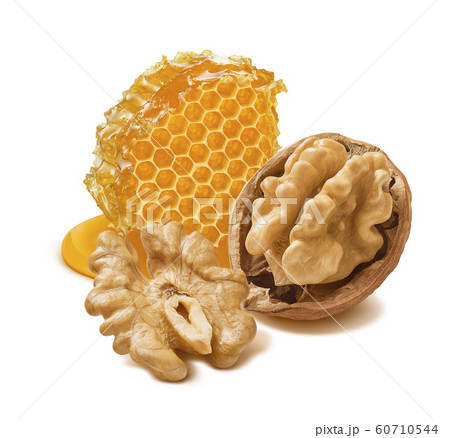 Walnut nut and honeycomb isolated on white background Walnut nut and honeycomb isolated on white background 60710544