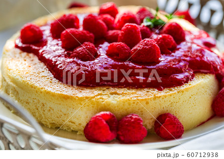 Cheesecake with raspberry sauce 60712938
