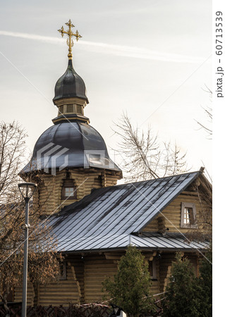 Orthodox tree Russian church covered with snow. Wooden Church Before Christmas 60713539