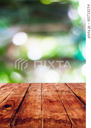 Empty wooden table with blurred on nature bokeh background Empty wooden table with blurred on nature bokeh background 60718254