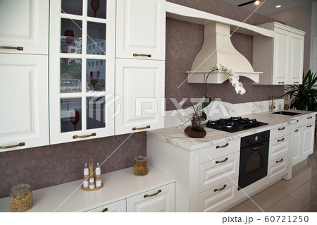 Interior of luxurious modern kitchen white 60721250
