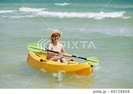Happy kayaking woman 60726608
