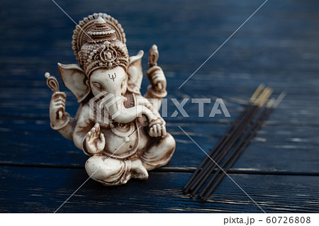 Hindu god Ganesh on black background. Statue on 60726808