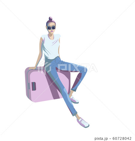 A young girl is sitting on a suitcase in the A young girl is sitting on a suitcase in the 60728042