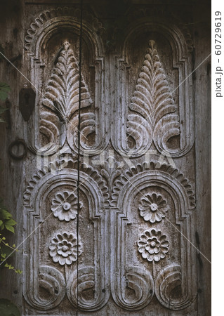 Wooden window platband with beautiful ornament 60729619