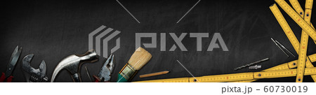Hand tools on a blackboard with copy space - Home improvement concept Hand tools on a blackboard with copy space - Home improvement concept 60730019