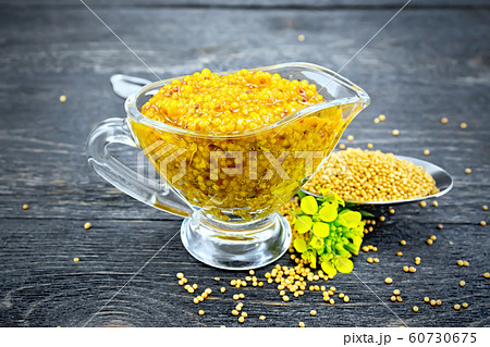 Sauce mustard Dijon in sauceboat with flower 60730675