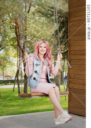 Portrait of a lovely pink-haired girl outdoors Portrait of a lovely pink-haired girl outdoors 60731105
