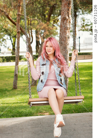 Portrait of a lovely pink-haired girl outdoors Portrait of a lovely pink-haired girl outdoors 60731106