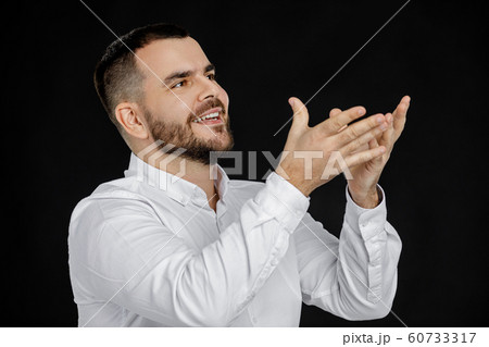 bearded man in white shirt telling something 60733317