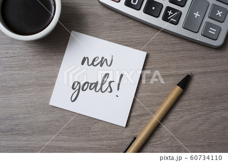 text new goals in a note on a desk text new goals in a note on a desk 60734110