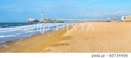 North Sea beach and Scheveningen Pier near Hague, Holland 60734406