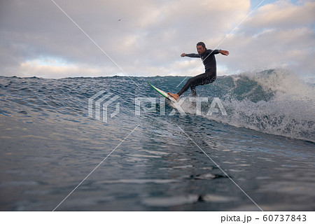 surfer riding waves on the island of fuerteventura 60737843
