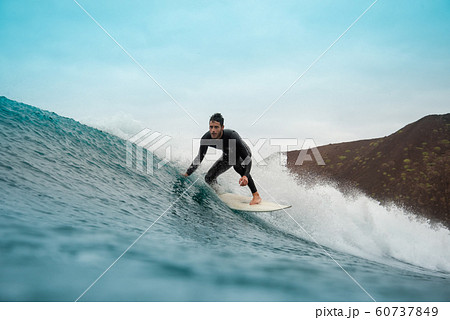 surfer riding waves on the island of fuerteventura surfer riding waves on the island of fuerteventura 60737849