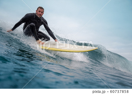 surfer riding waves on the island of fuerteventura surfer riding waves on the island of fuerteventura 60737858