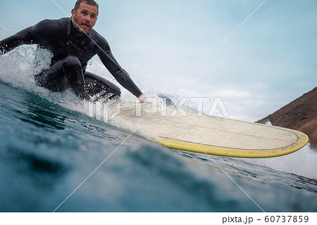 surfer riding waves on the island of fuerteventura surfer riding waves on the island of fuerteventura 60737859