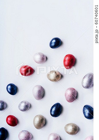 Colored chicken and quail eggs of pink, silver, golden and blue color  60740601