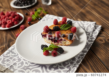 Piece of pie with blueberries, rasberry and mint Piece of pie with blueberries, rasberry and mint 60741274