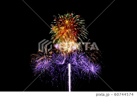 Fireworks light up in the night sky, dazzling Fireworks light up in the night sky, dazzling 60744574
