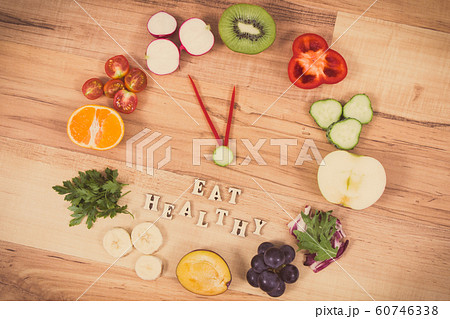 Fruits and vegetables in shape of clock 60746338