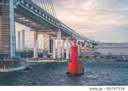 Small Red metal lighthouse under Yokohama bridge 60747538