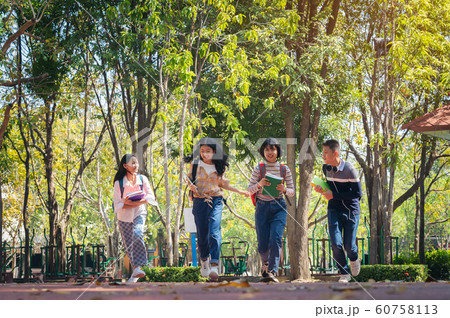 Group of student happy young people running Group of student happy young people running 60758113