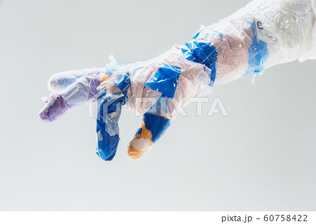 Big plastic hand made of garbage isolated on white studio background 60758422