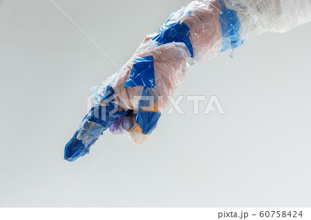 Big plastic hand made of garbage isolated on white studio background 60758424