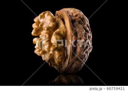 Half opened walnut with kernel isolated on a black background with clipping path 60759421