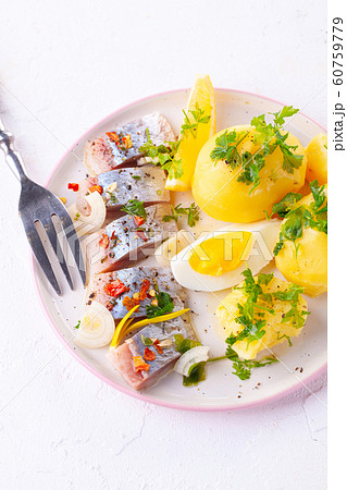 pieces of salted herring in spices with boiled pieces of salted herring in spices with boiled 60759779