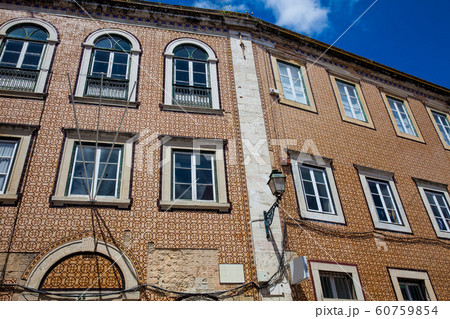 Traditional architecture of the facades covered with ceramic tiles called azulejos in the city of Lisbon in Portugal Traditional architecture of the facades covered with ceramic tiles called azulejos in the city of Lisbon in Portugal 60759854