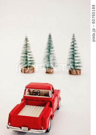 miniature red car in the back carries a Christmas miniature red car in the back carries a Christmas 60760188