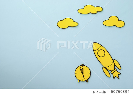 Little yellow rocket speeding through space blue sky background Little yellow rocket speeding through space blue sky background 60760394
