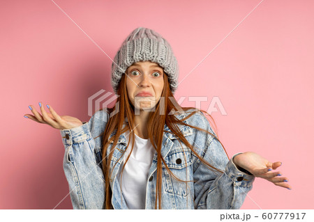 Portrait of excited young woman dressed denim Portrait of excited young woman dressed denim 60777917