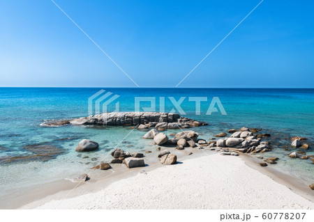 Lanscape view of white stones in blue sea. 60778207