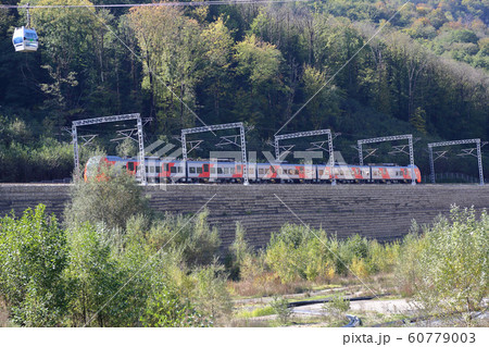 High-speed passenger train moves through a 60779003