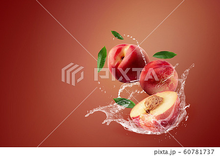 Water splashing on fresh Nectarine fruit on red Water splashing on fresh Nectarine fruit on red 60781737