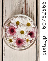 Beautiful white and pink chrysanthemums in a glass 60782566