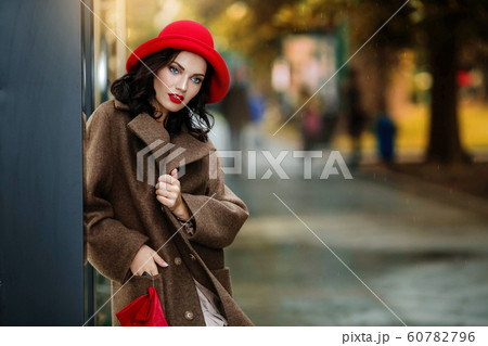 Close-up sexy woman with bright makeup and glamorous autumn clothes 60782796