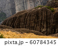 Yellow grass and brown mountains in Greece 60784345
