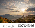 Sunny mountains and cloudy skies in Greece 60784346
