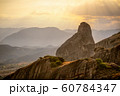 High mountains against a misty sky in Greece 60784347