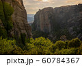 High mountains and green trees against the sky 60784367