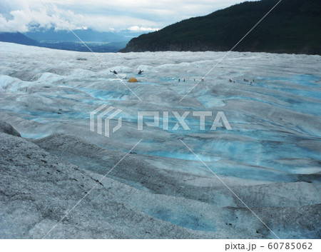 Two Helicopters, Tent And A Dozen Of Hikers On Mendenhall Glacier, Alaska Two Helicopters, Tent And A Dozen Of Hikers On Mendenhall Glacier, Alaska 60785062