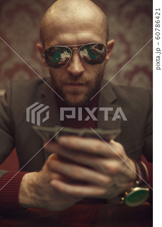 Professional poker player playing in casino Professional poker player playing in casino 60786421